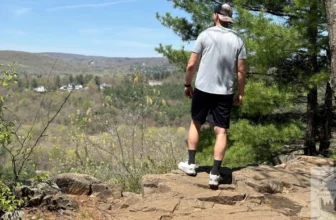 Standing at the top of the summit looking out, after testing out Trail Running Shoes