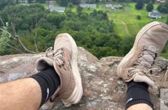 hiking boots on top of mountain after trek