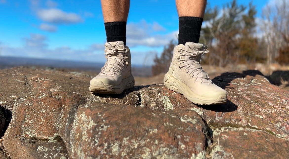 Hoka kaha 3 on rocks with blue sky in background