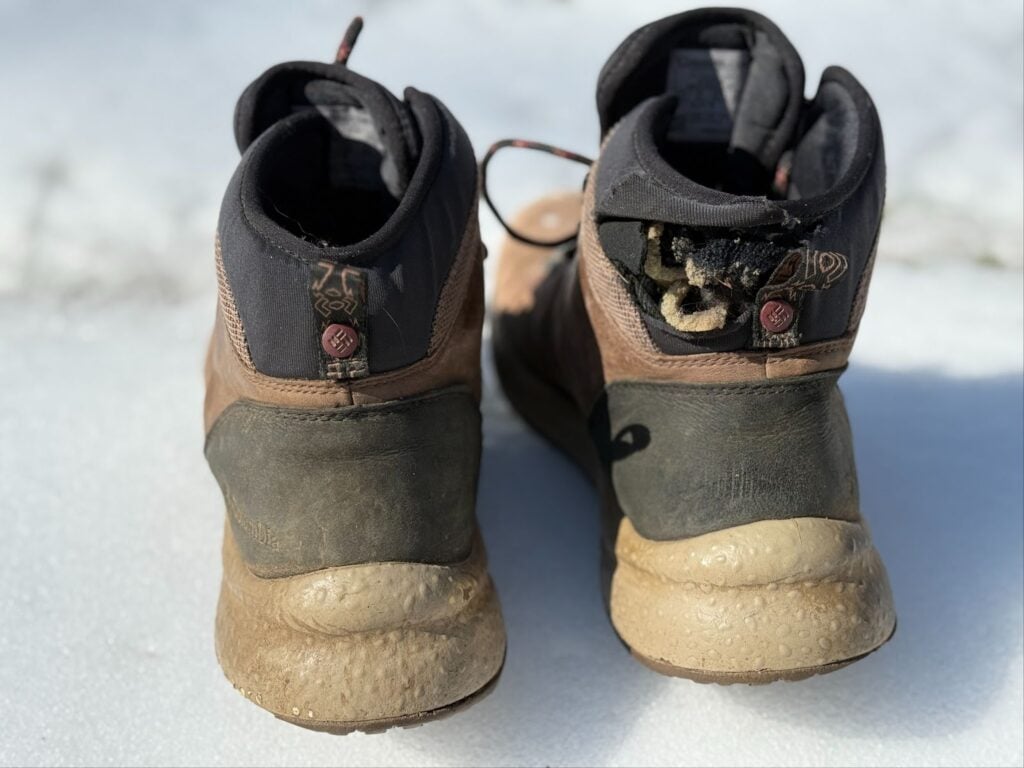 Showing the flattening of the outsole and the hole in the heel cuff