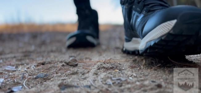 view of hiking boot putting pressure on foot