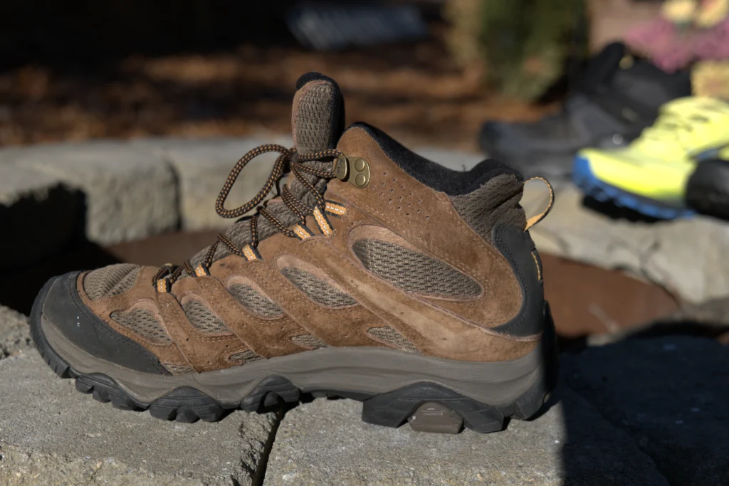 Merrell Moab 3 after 150 miles of trail testing, showing no structural breakdown, intact stitching on the suede upper, and zero delamination at the rubber toe cap.