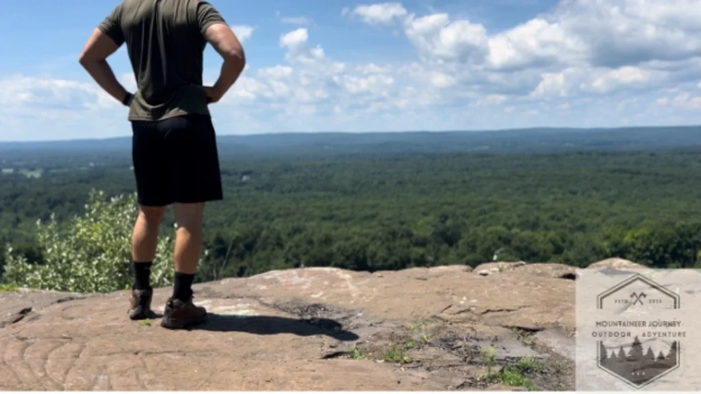 Wearing the Moab 3 at the top of a summit