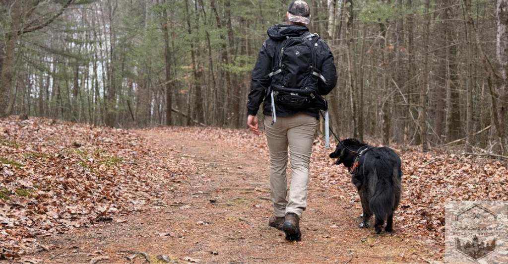 walking dog on hike in woods while wearing lowa renegade's