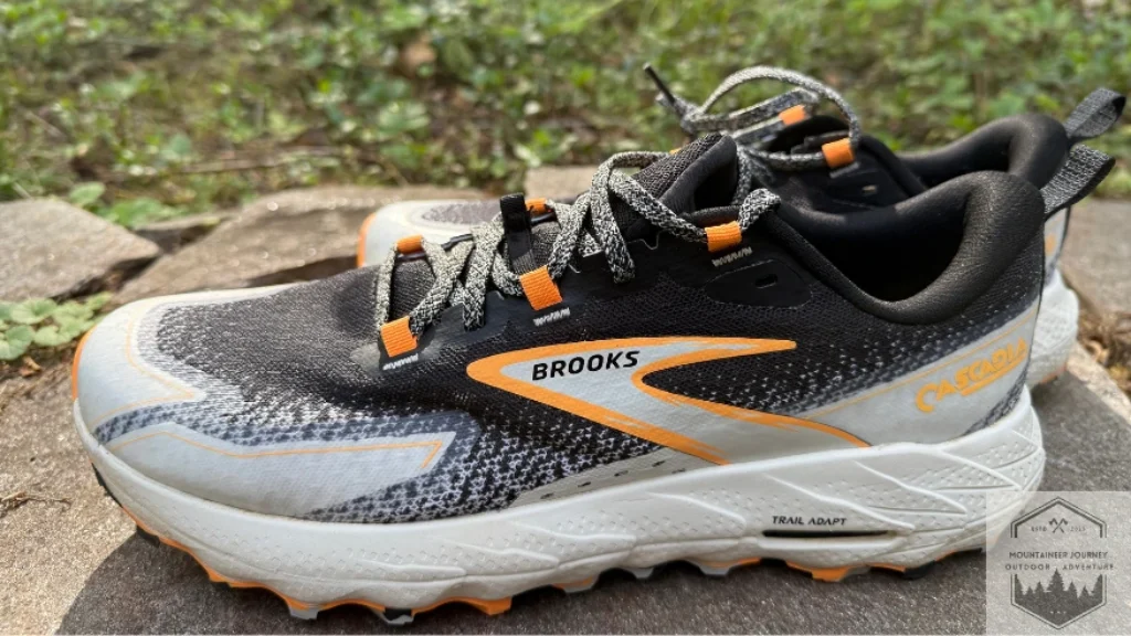 Side view of the brooks cascadia 18 sitting on a wall 
