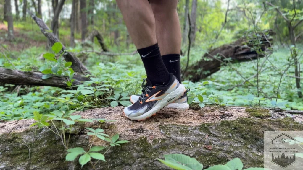 wearing the cascadia 18 on a log testing the midsole comfort