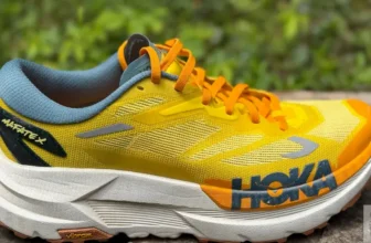 Side view of the Hoka Mafate X resting on a stone wall