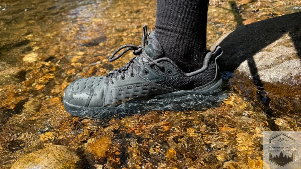 Testing the waterproofness of the Altra Olympus 6 in the water during our 10 minute submersion testing