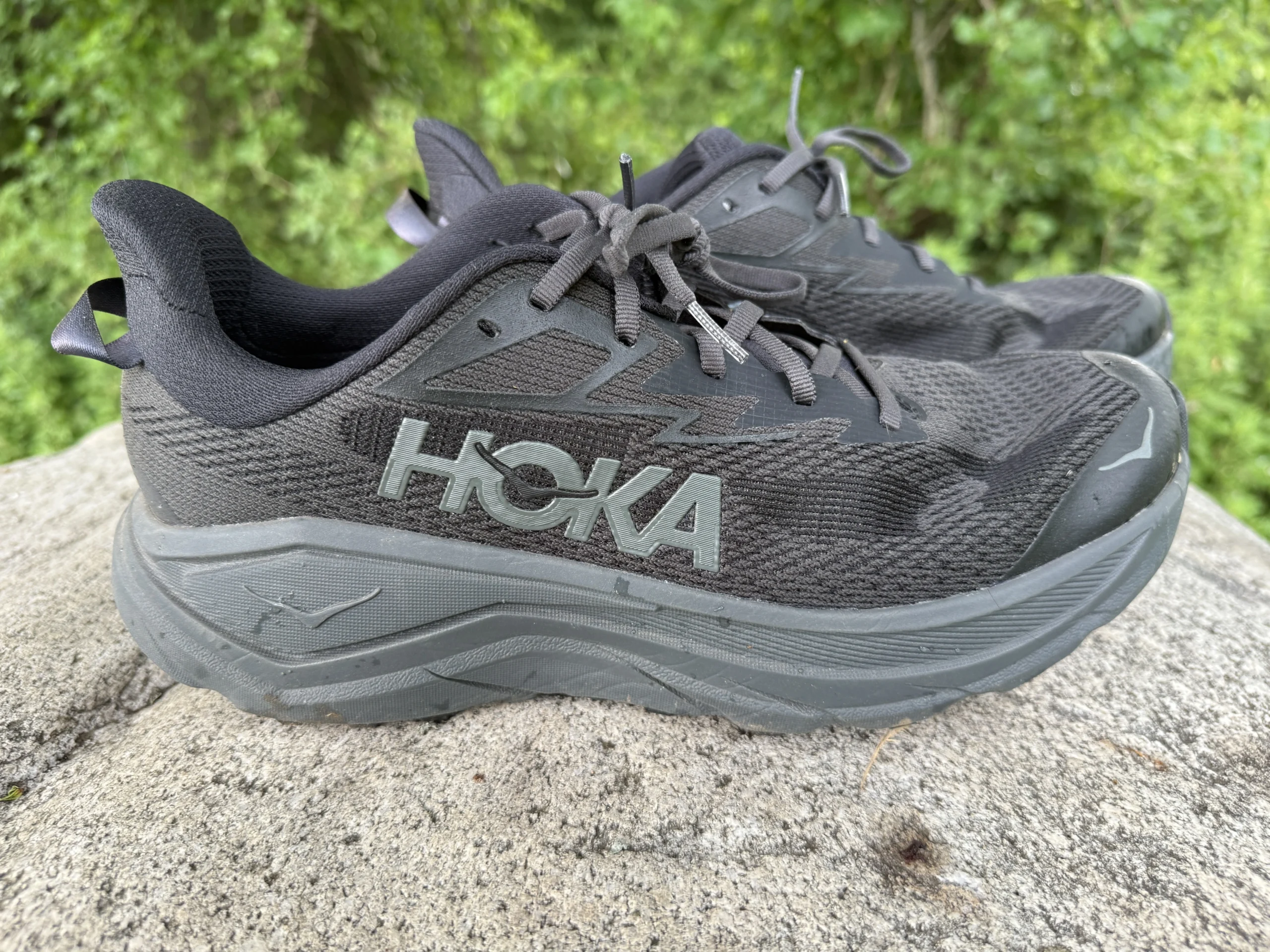 side view of the Hoka Challenger 8 on rocks