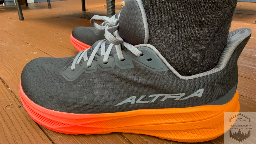 wearing the Altra Experience Flow Experience 2 on a wooden deck