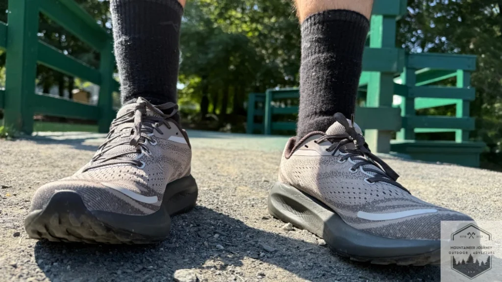 Front view of both shoes while standing in gravel