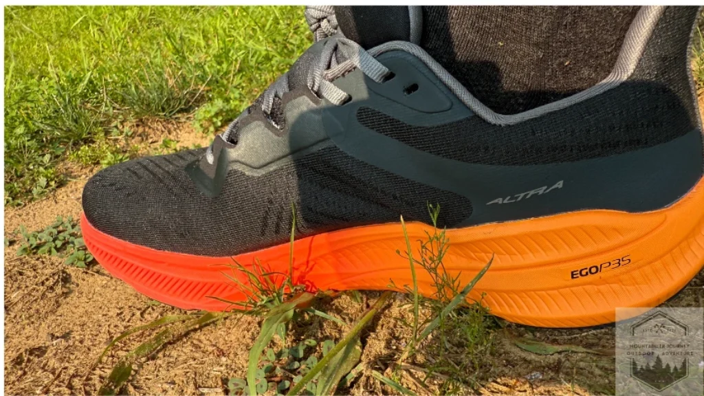 side view of the flow 2, view of egop35 sign on the outsole while on dirt