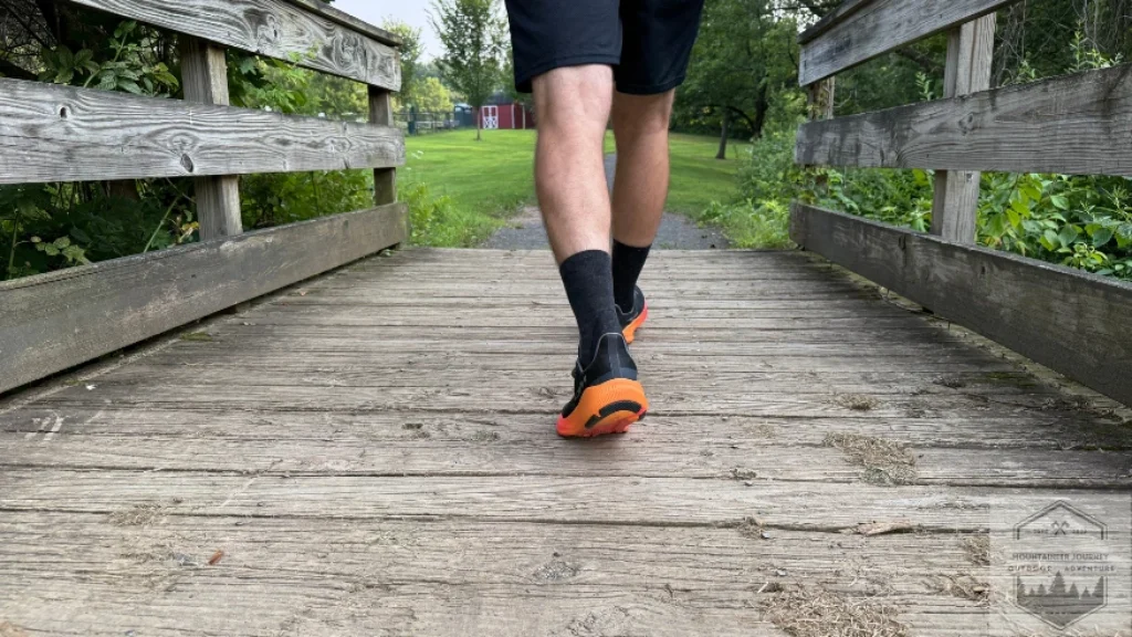 walking over a bridge during our testing of the Altra Experience Flow