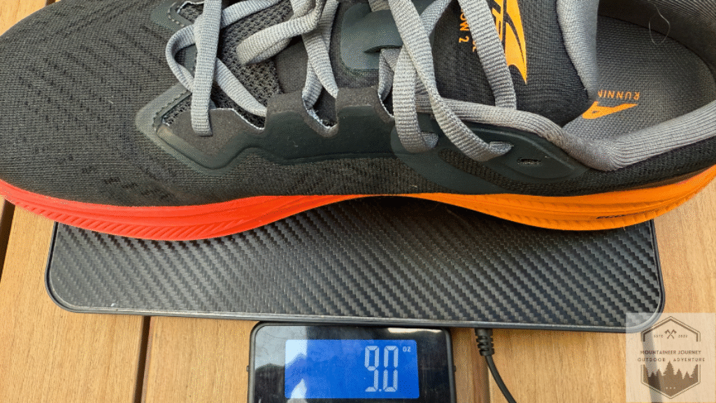weighing the altra experience flow 2 on our scale at 9 ounces