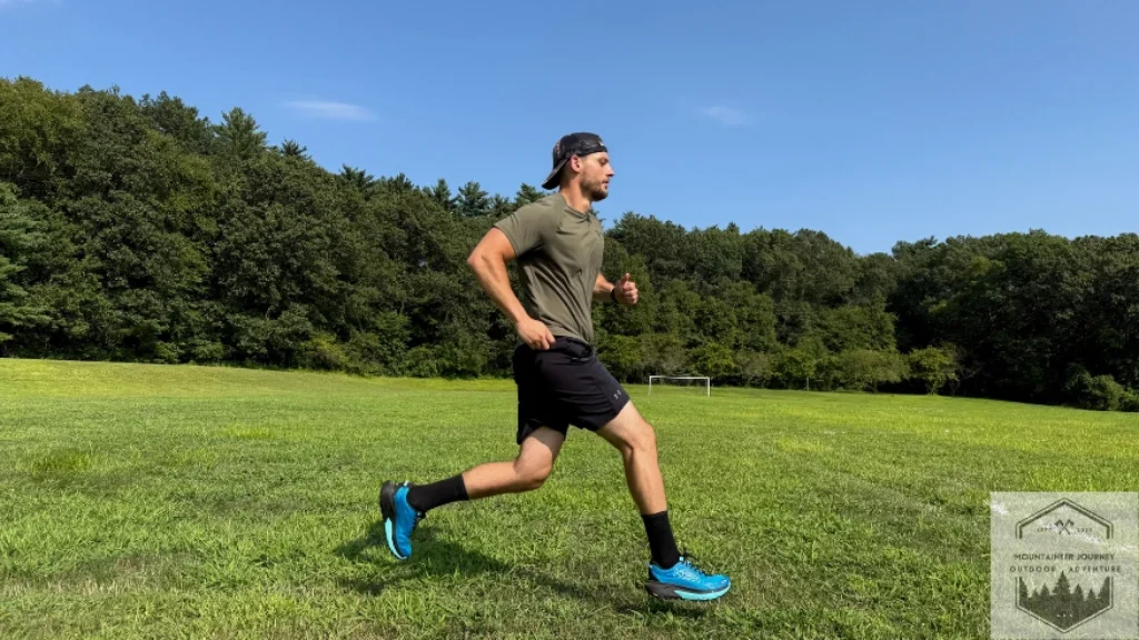 running in grass during testing with the Hoka Mafate 5, impact absorption was impeccable