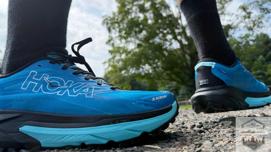side view of the Mafate 5 on gravel, revealing the small TPU crown in forefoot
