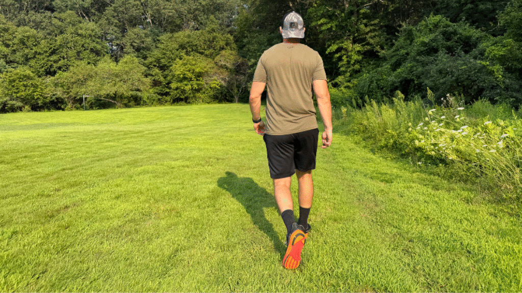 Walking in the grass during testing with the Altra Experience Flow 2