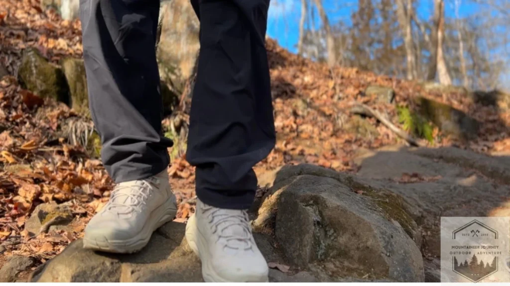 Standing on a rock during a trail hike with Hoka Kaha 3