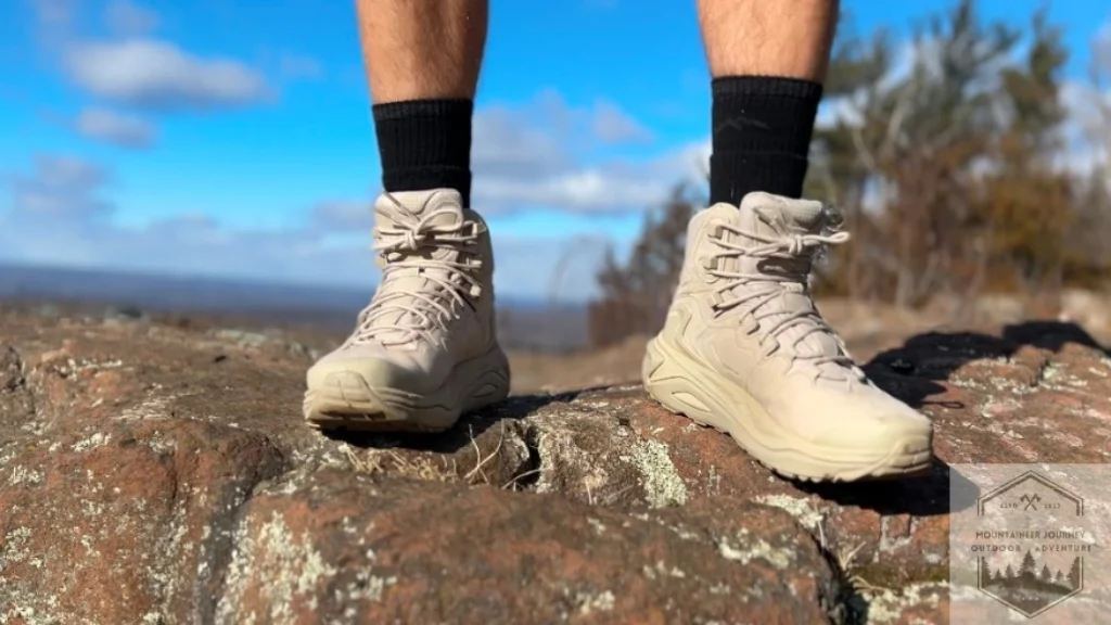Standing on rock with Hoka Kaha 3 testing the comfort