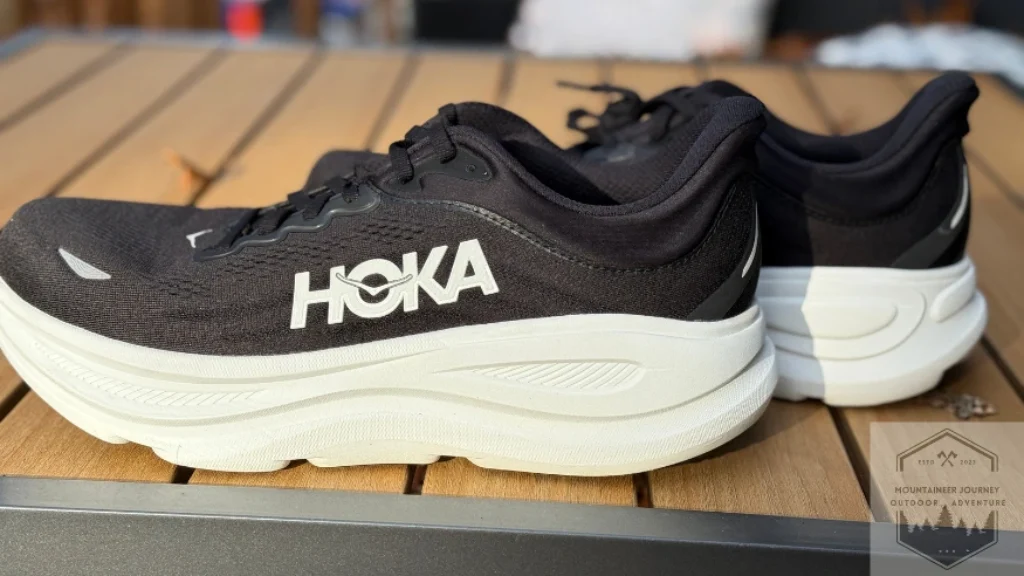 Side profile view of the Hoka Bondi 9 pair showcasing the massive stack height and the signature compression-molded supercritical EVA foam for maximum impact protection.