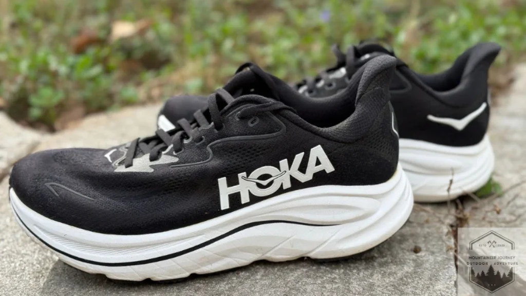 View of the Hoka Clifton 10 sitting on a concrete wall.