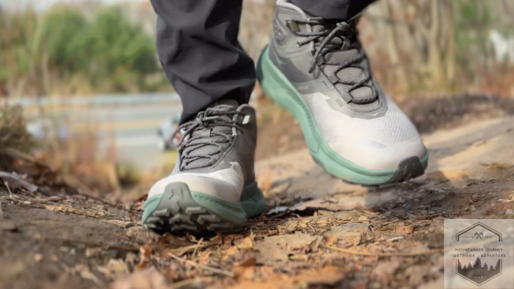 Hiking uphill covered with leaves with the Hoka Transport GTX.