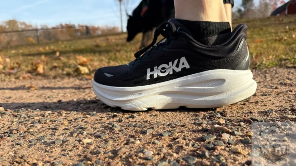 Objective field testing of the Hoka Bondi 9 across multiple surfaces, including concrete, grass, and gravel, to evaluate cushioning consistency and traction durability.