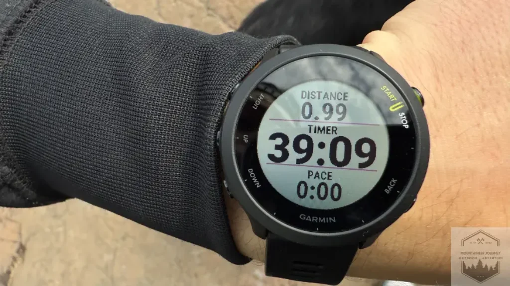 View of full watchface on Garmin Forerunner 55. Bright screen display wiht time, pace, and distance