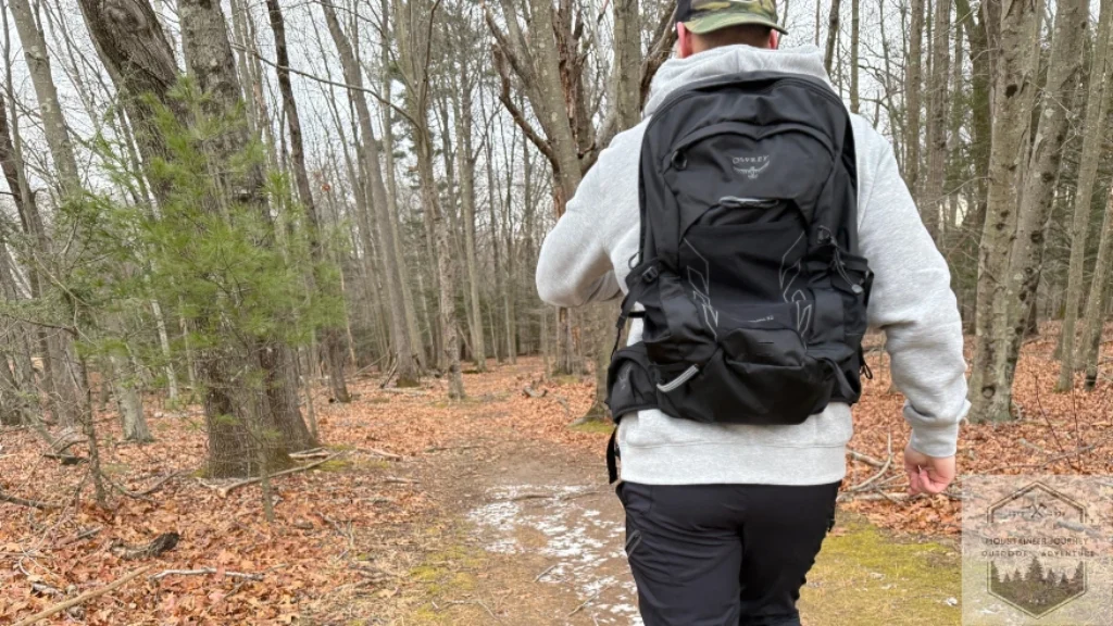 Looking down at watch during objective scoring on the trail
