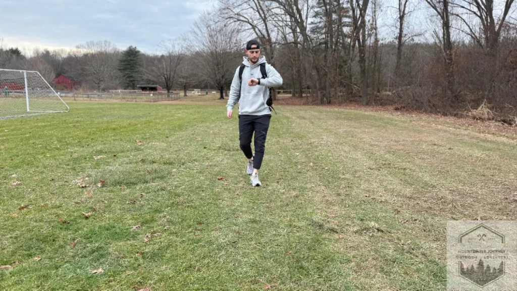 Looking down at Garmin Fenix Pro 8 during testing in open field