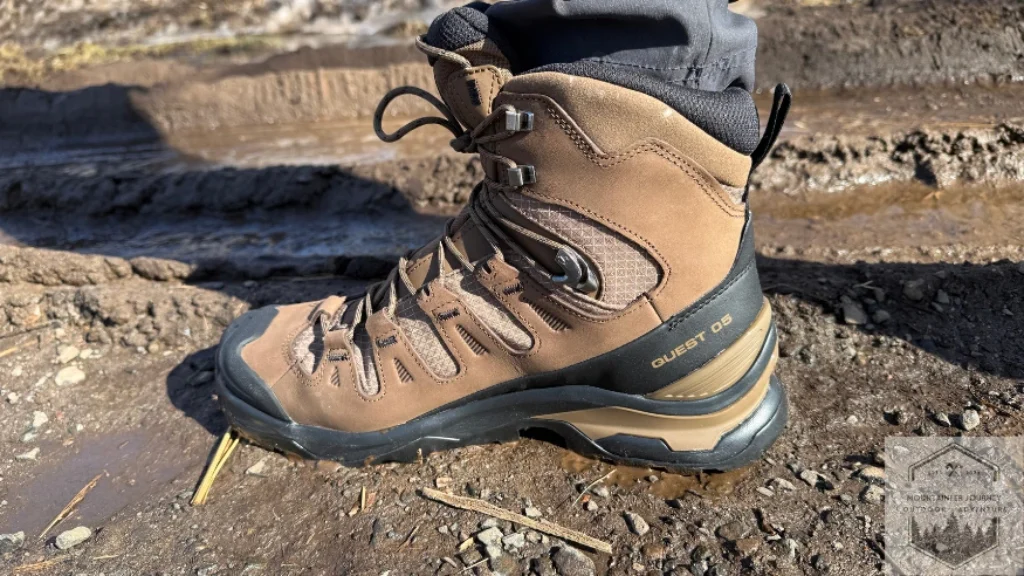 Salomon Quest 5 on muddy trail during testing