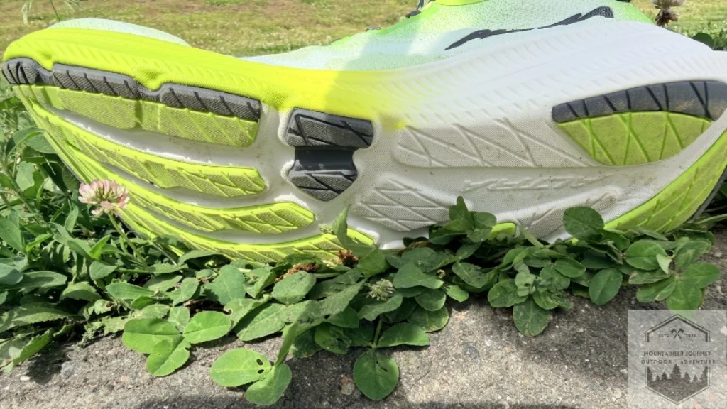 View of outsole, smaller rubberized areas on lateral aspects of shoe